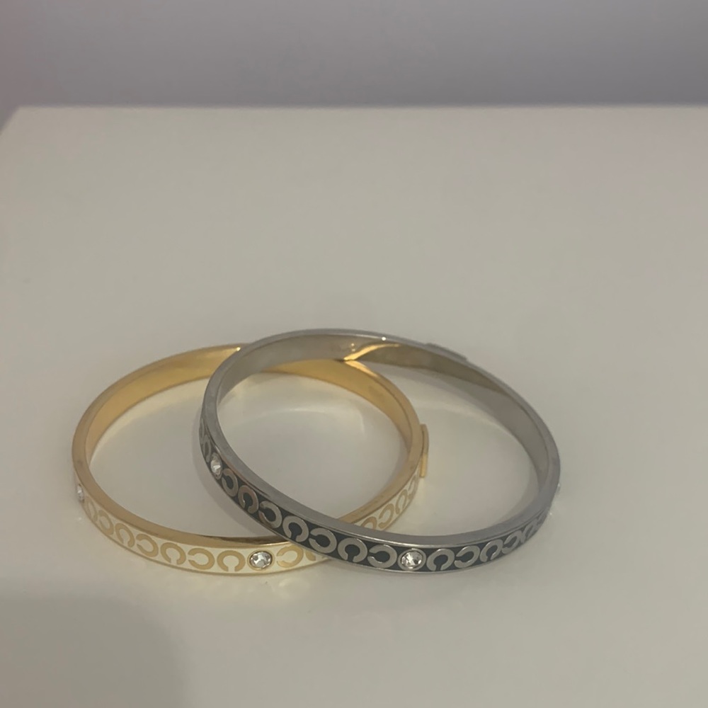 Two Coach bracelets